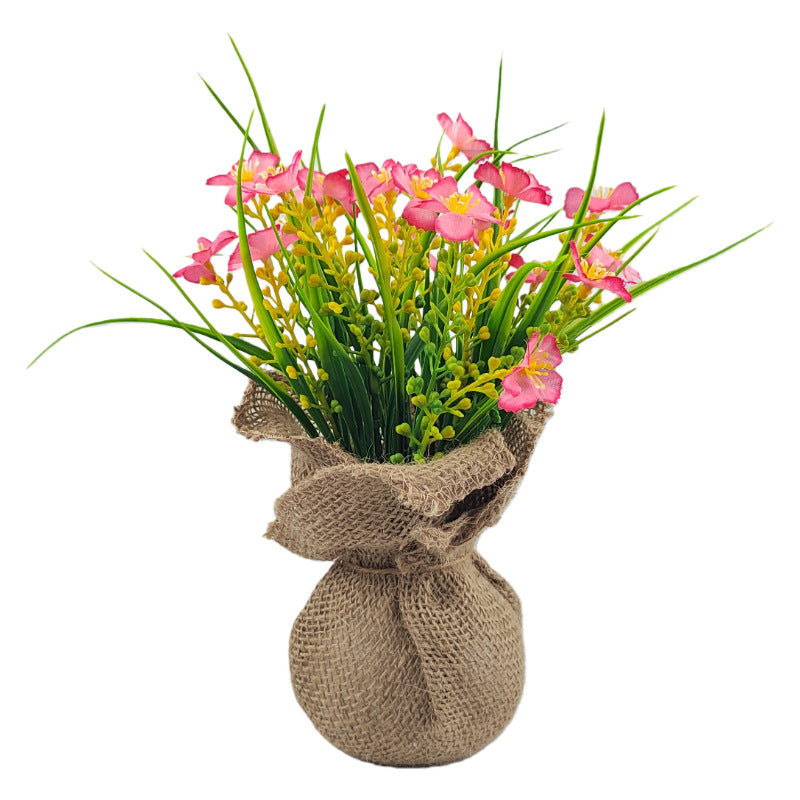 Spring burlap-wrapped artificial begonia potted plants